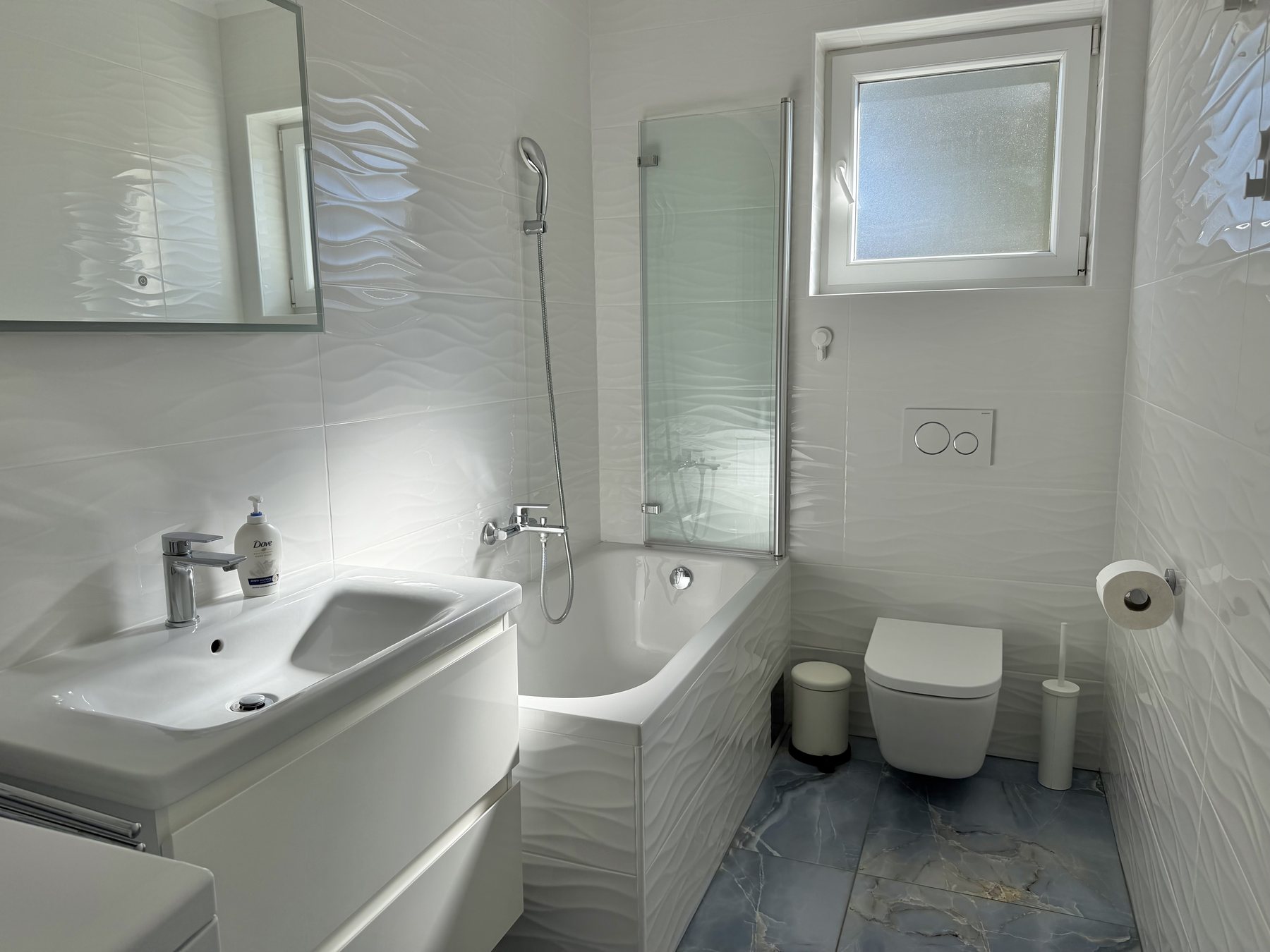 Apartment Blue bathroom with a bathtub and shower
