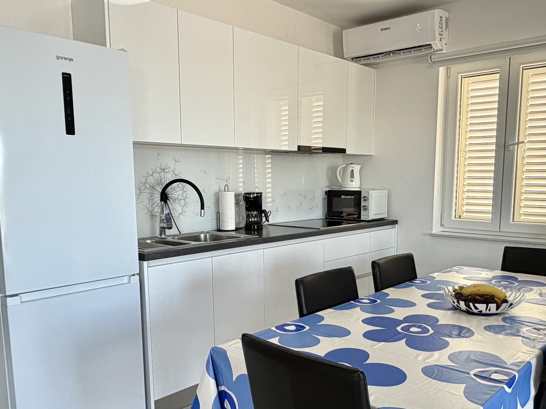Apartment Blue kitchen and dining area