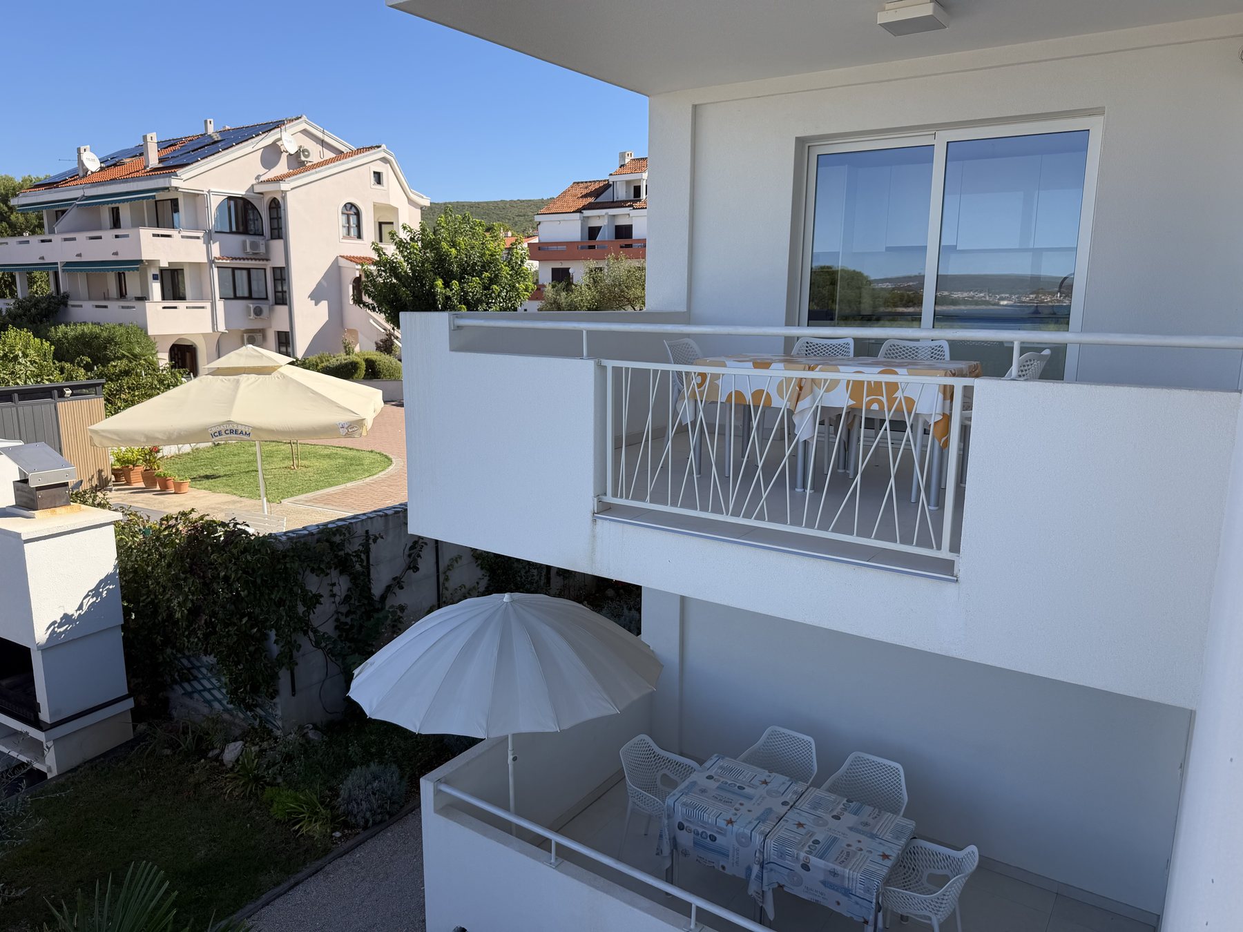 View from the house terrace over nearby rooftops and the sea
