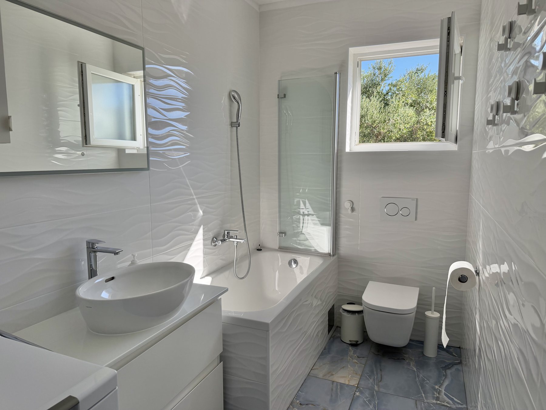 Apartment Yellow bathroom with a bathtub and shower